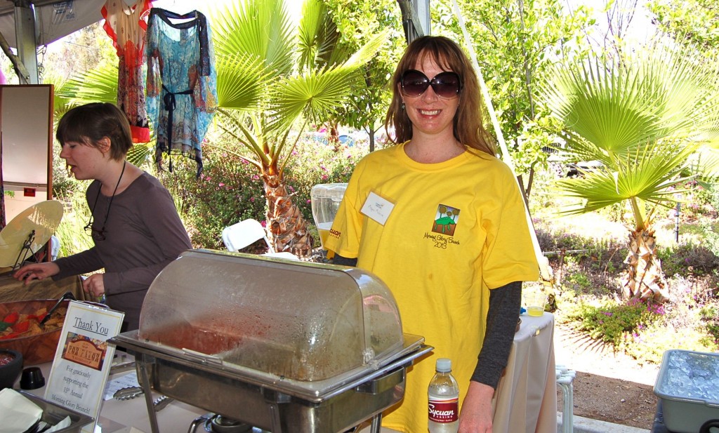 Megan McGuire '01 arrived midday to help hand out delicious pasta from a local restaurant. At left is Julia McDonald x'12.