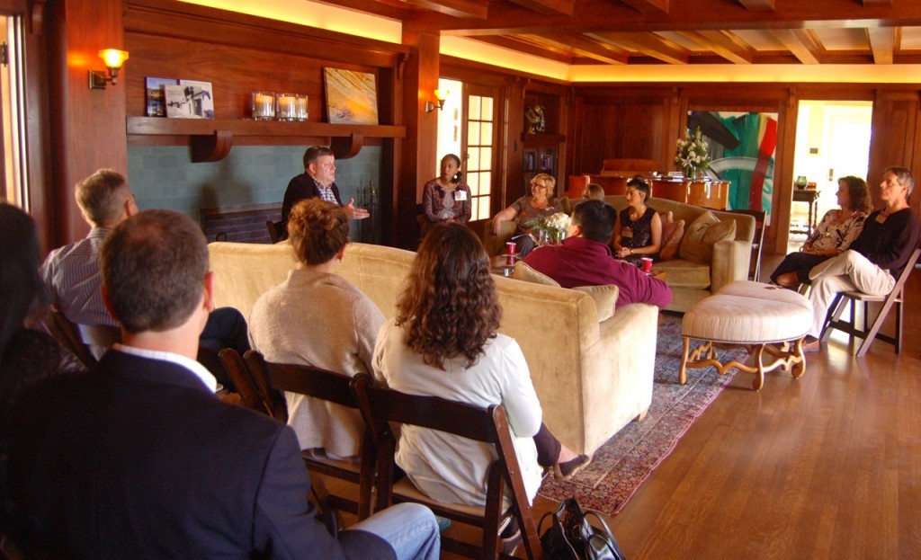 Terrence Devino, SJ, BC vice president and secretary, center rear, leads a book discussion for BC San Diego alumni.