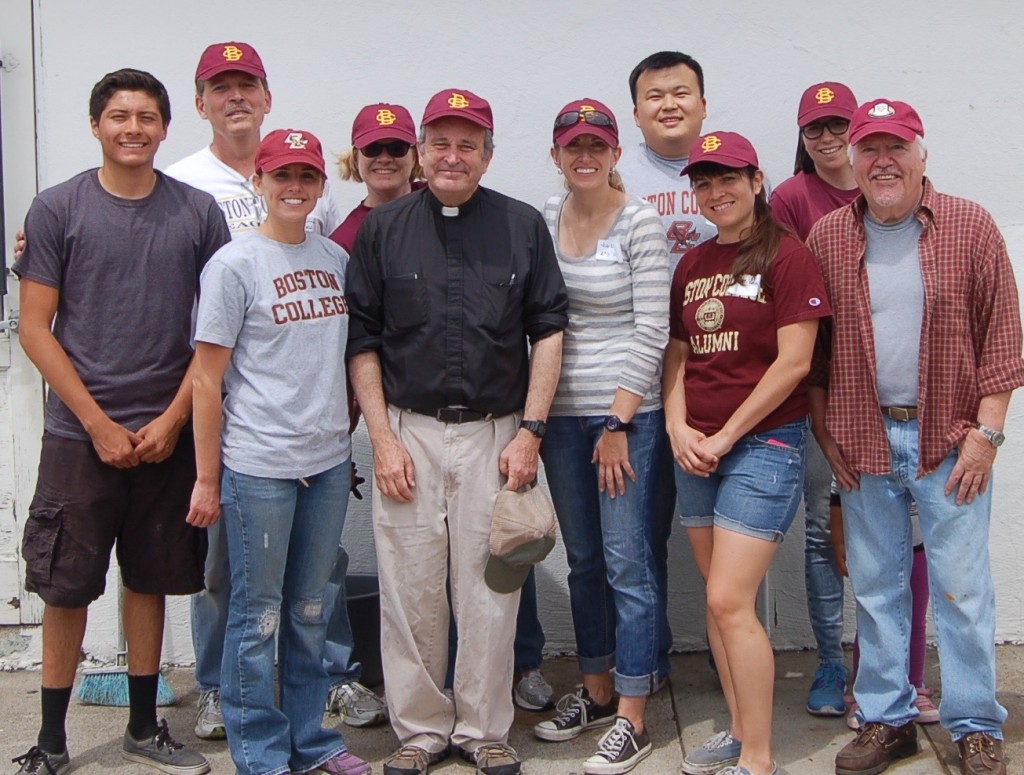 From left: a high school student at Our Lady's School; Greg Cortese JD'74; Erin Buss '09; Rebecca Reid '96; Rev. John Auther, SJ, pastor; Jill Kelley '01; Brian Tsu '00; Katrina Vasquez '10; Lissa Tsu '00; and Bill McDonald '68. Patricia Keefe '89 and son William had to leave before the photo was taken.