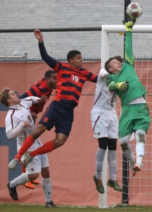 Senior goaltender Alex Kapp makes one of his nine saves against Syracuse.